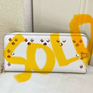 SOLD. Authentic Kate Spade multifaceted spades studded wallet